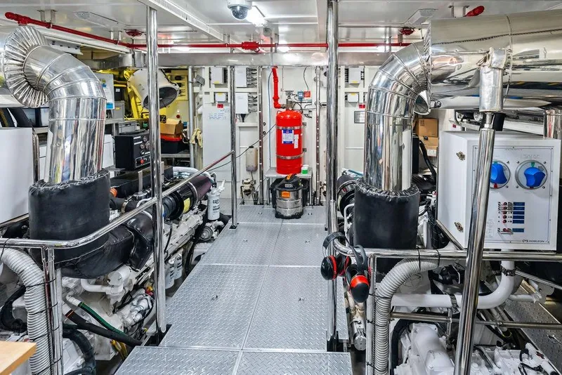 Slide: The Image of Engine room of 2014 Horizon RP 110 yacht with polished metal pipes and equipment. - 101
