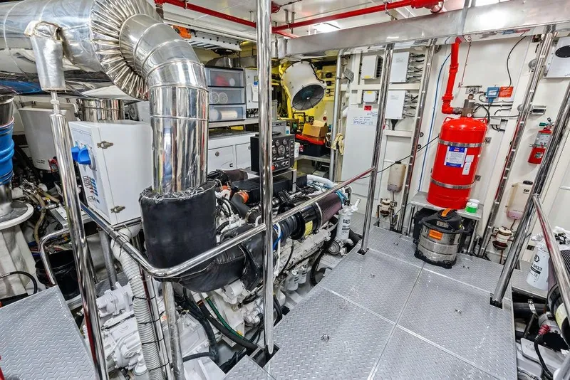 Slide: The Image of Engine room of 2014 Horizon RP 110 yacht, featuring advanced machinery and safety equipment. - 102