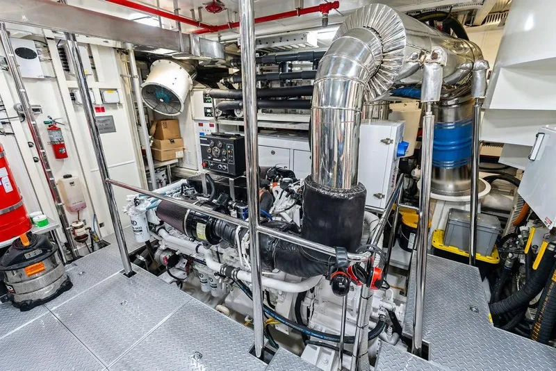 Slide: The Image of Engine room of 2014 Horizon RP 110 yacht, featuring advanced machinery and equipment. - 103