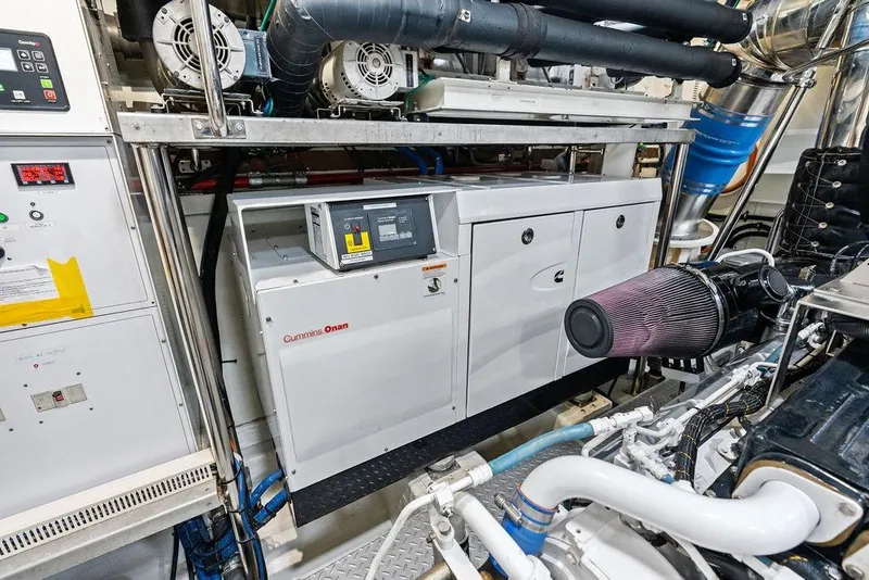Slide: The Image of Engine room of 2014 Horizon RP 110 yacht featuring Cummins Onan generator and control systems. - 106