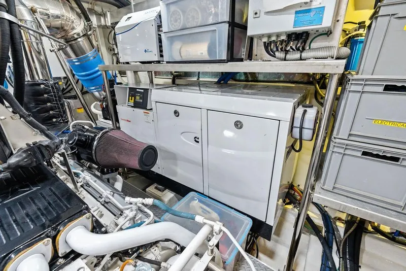 Slide: The Image of Engine room of 2014 Horizon RP 110 yacht with machinery and storage. - 107