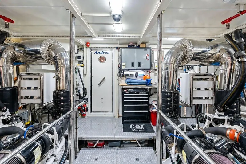 Slide: The Image of Engine room of 2014 Horizon RP 110 yacht with metallic pipes and equipment. - 110