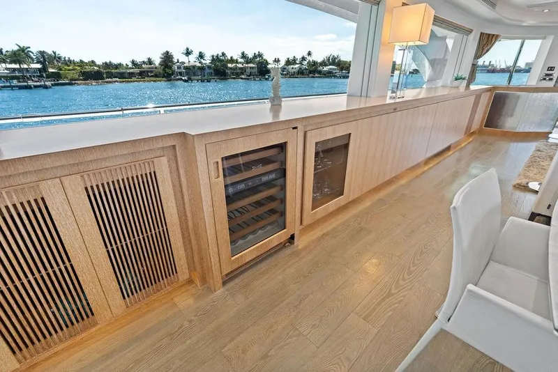 Slide: The Image of Luxurious interior of 2014 Horizon RP 110 yacht with elegant wood cabinetry and scenic water views. - 31