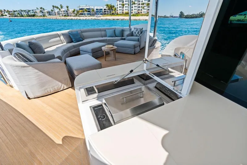 Slide: The Image of Luxurious Horizon RP 110 yacht deck with modern seating and ocean view, 2014 model. - 38