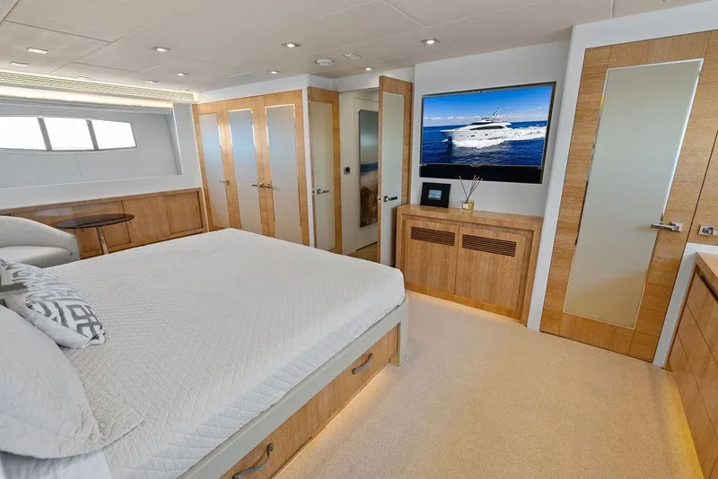 Slide: The Image of Luxurious bedroom interior on 2014 Horizon RP 110 yacht with modern decor and large TV. - 45