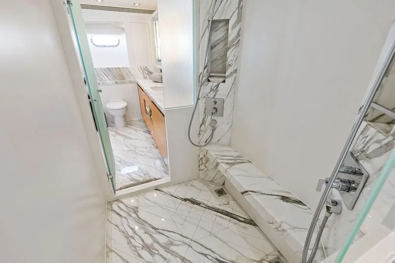 Slide: The Image of Luxurious marble bathroom in 2014 Horizon RP 110 yacht, featuring modern shower and toilet. - 48