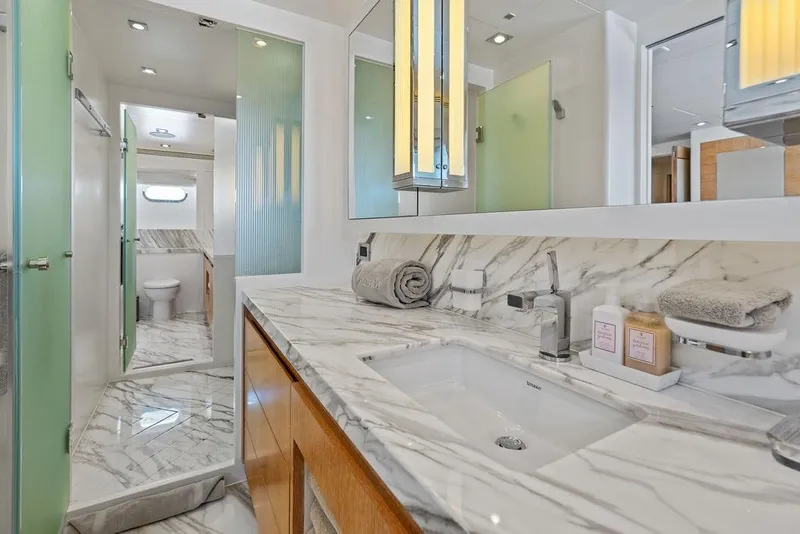 Slide: The Image of Luxurious yacht bathroom with marble countertops, modern fixtures, and elegant lighting on Horizon RP 110, 2014. - 49