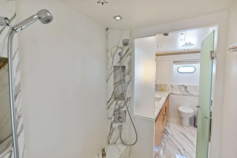 Slide: The Image of Luxurious bathroom in 2014 Horizon RP 110 yacht with marble accents and modern fixtures. - 50