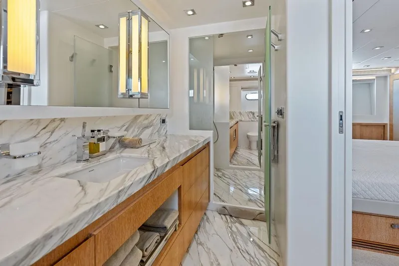 Slide: The Image of Luxurious bathroom in 2014 Horizon RP 110 yacht with marble countertops and modern fixtures. - 51