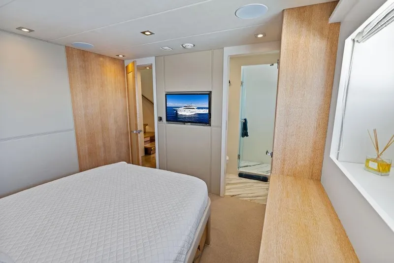 Slide: The Image of Luxurious bedroom interior of 2014 Horizon RP 110 yacht with modern decor and ensuite bathroom. - 53