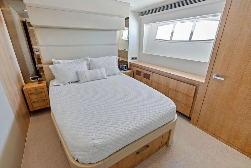 Slide: The Image of Luxurious bedroom interior on 2014 Horizon RP 110 yacht, featuring elegant wood finishes and modern design. - 56