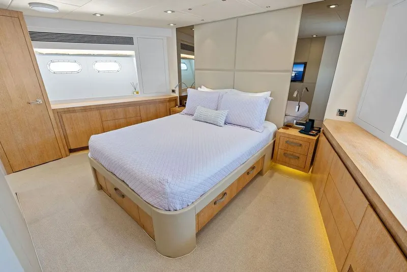 Slide: The Image of Luxurious bedroom interior on 2014 Horizon RP 110 yacht, featuring elegant wood finishes. - 58