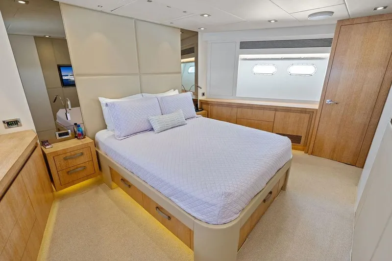 Slide: The Image of Luxurious bedroom interior on 2014 Horizon RP 110 yacht, featuring elegant wood finishes and modern design. - 59