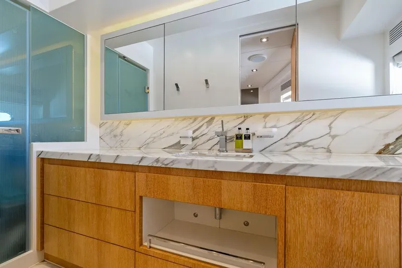 Slide: The Image of Luxurious yacht bathroom with marble countertop and wooden cabinetry, Horizon RP 110, 2014 model. - 61
