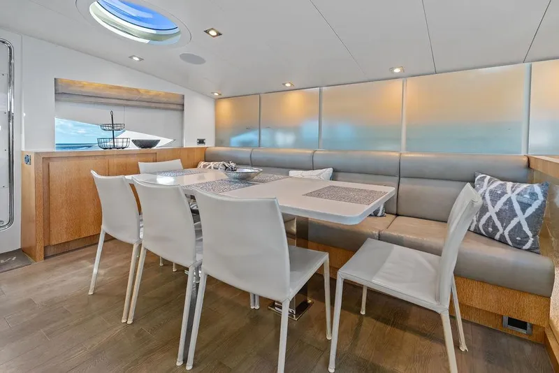 Slide: The Image of Luxurious dining area inside 2014 Horizon RP 110 yacht with modern decor and ocean view. - 65