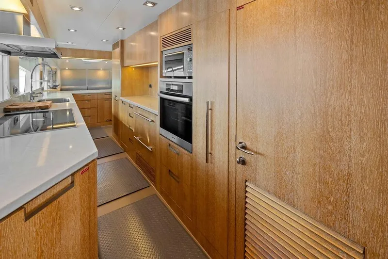 Slide: The Image of Luxurious kitchen interior of 2014 Horizon RP 110 yacht with modern appliances and wood finish. - 67