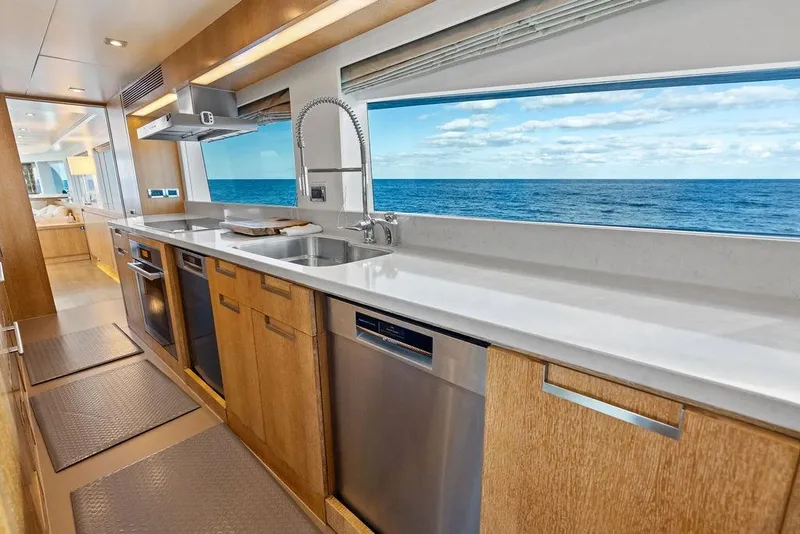 Slide: The Image of Luxurious Horizon RP 110 yacht kitchen with ocean view, modern appliances, and sleek design, 2014 model. - 69