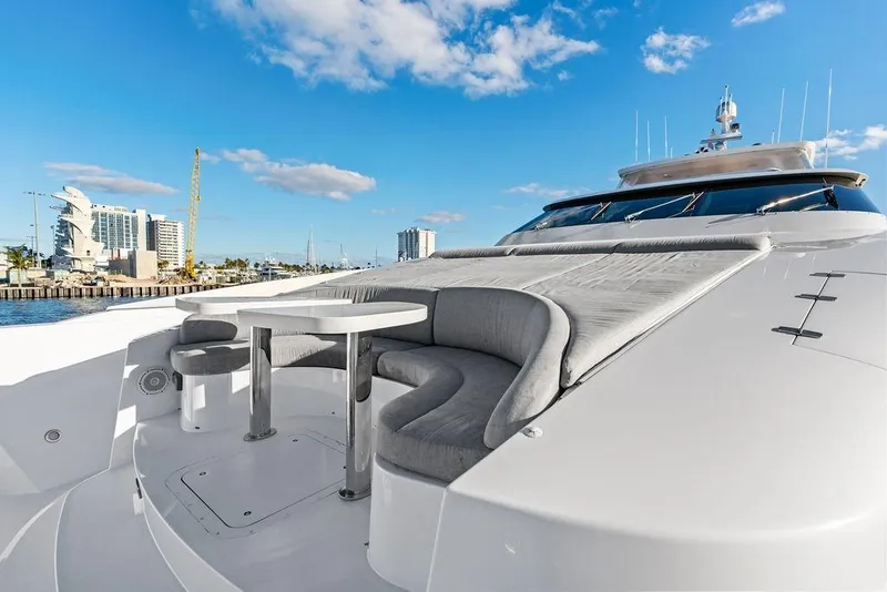 Slide: The Image of Luxurious Horizon RP 110 yacht deck with seating, 2014 model, under a clear blue sky. - 86