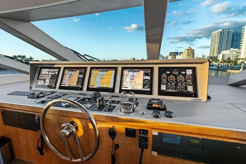Slide: The Image of Cockpit of 2014 Horizon RP 110 yacht with navigation screens and steering wheel. - 88