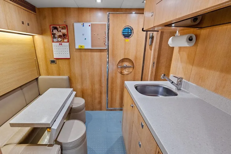 Slide: The Image of Compact kitchen and dining area in 2014 Horizon RP 110 yacht interior. - 95