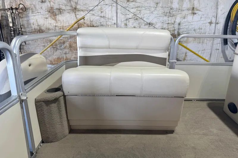 Slide: The Image of 2008 Sun Tracker Party Barge 200 Classic Series boat seat, beige upholstery, indoor setting. - 10