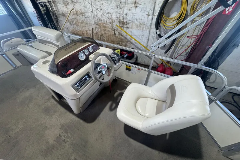 Slide: The Image of 2008 Sun Tracker Party Barge 200 Classic Series interior with steering console and seating. - 13