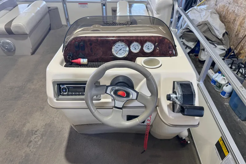 Slide: The Image of 2008 Sun Tracker Party Barge 200 Classic Series dashboard with steering wheel and controls. - 14