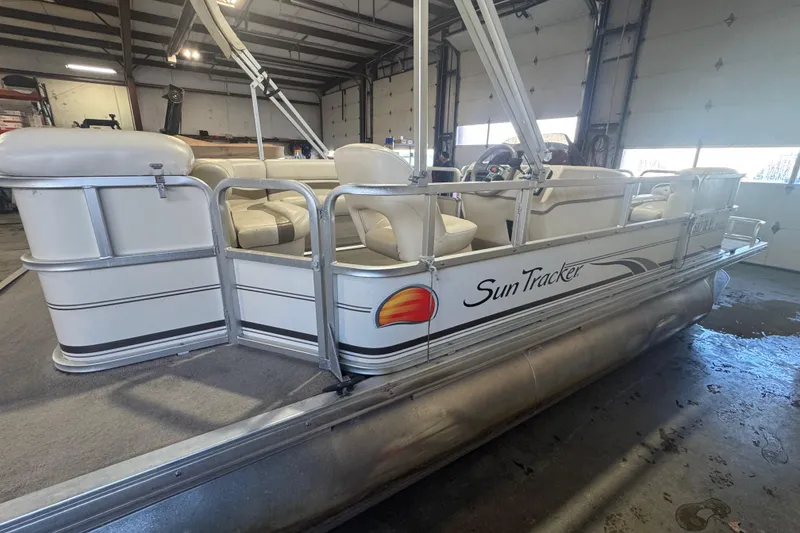 Slide: The Image of 2008 Sun Tracker Party Barge 200 Classic Series pontoon boat in a garage setting. - 3