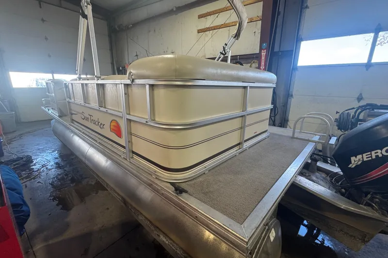 Slide: The Image of 2008 Sun Tracker Party Barge 200 Classic Series pontoon boat in a garage setting. - 6