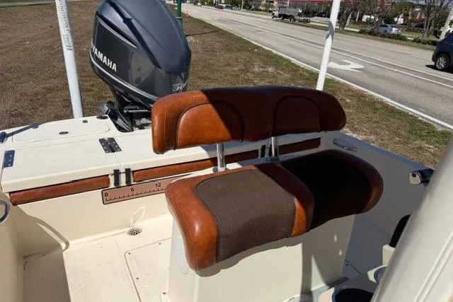 Slide: The Image of 2014 Scout 251 XS boat with Yamaha engine and brown seating. - 11
