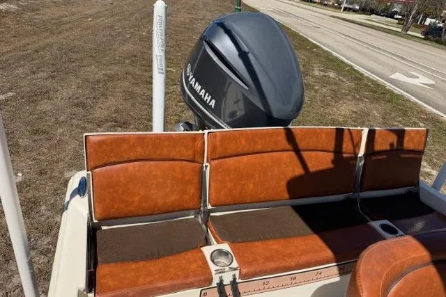 Slide: The Image of 2014 Scout 251 XS boat with Yamaha engine and brown seating. - 12