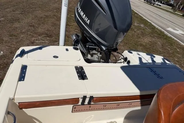 Slide: The Image of 2014 Scout 251 XS boat with Yamaha outboard motor, parked on grass. - 14