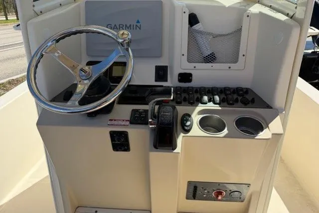 Slide: The Image of 2014 Scout 251 XS boat console with Garmin navigation and steering wheel. - 19