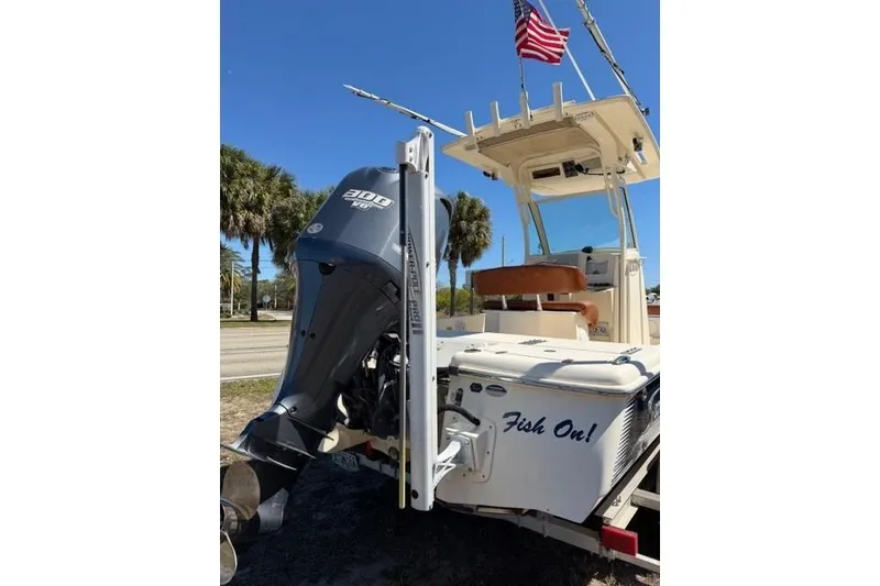 Slide: The Image of 2014 Scout 251 XS boat with Yamaha 300 engine and American flag. - 2