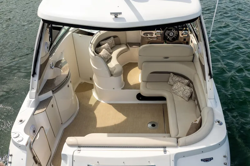 Slide: The Image of 2008 Chaparral Signature 350 boat interior with plush seating and elegant design on water. - 6
