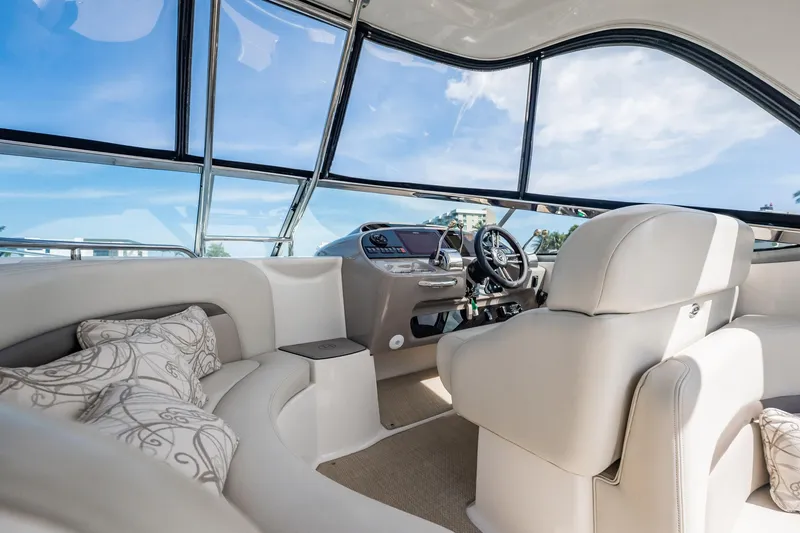 Slide: The Image of 2008 Chaparral Signature 350 yacht interior with plush seating and modern helm. - 9