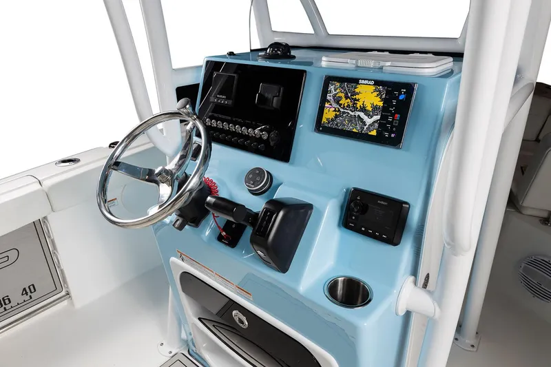 Slide: The Image of Manufacturer Provided Image: 2025 Sea Pro 225FLX Sandbar boat dashboard with steering wheel and navigation system. - 13