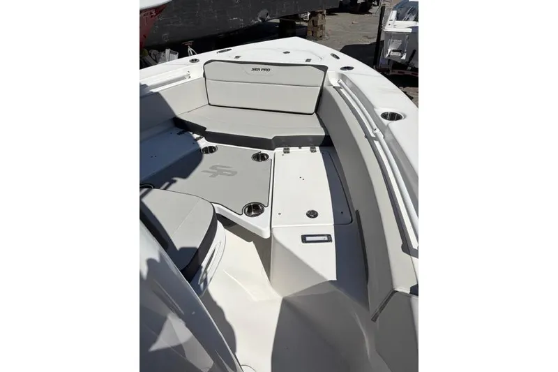 Slide: The Image of 2026 Sea Pro 225FLXR Sandbar boat interior with seating and storage compartments. - 6