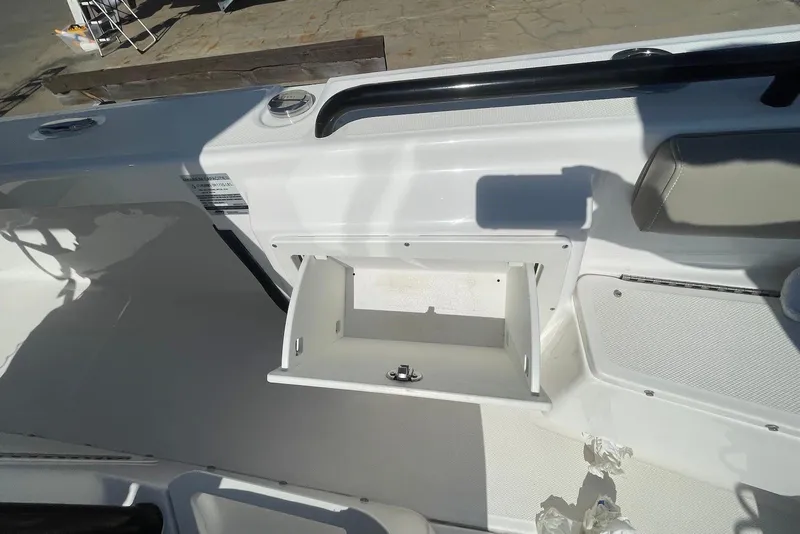 Slide: The Image of 2019 Everglades 243 Center Console boat interior with open storage compartment. - 20