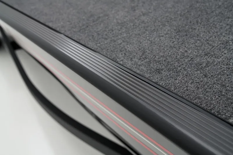 Slide: The Image of Manufacturer Provided Image: 2025 Tracker Bass Tracker Classic XL boat deck with textured surface and sleek design. - 6