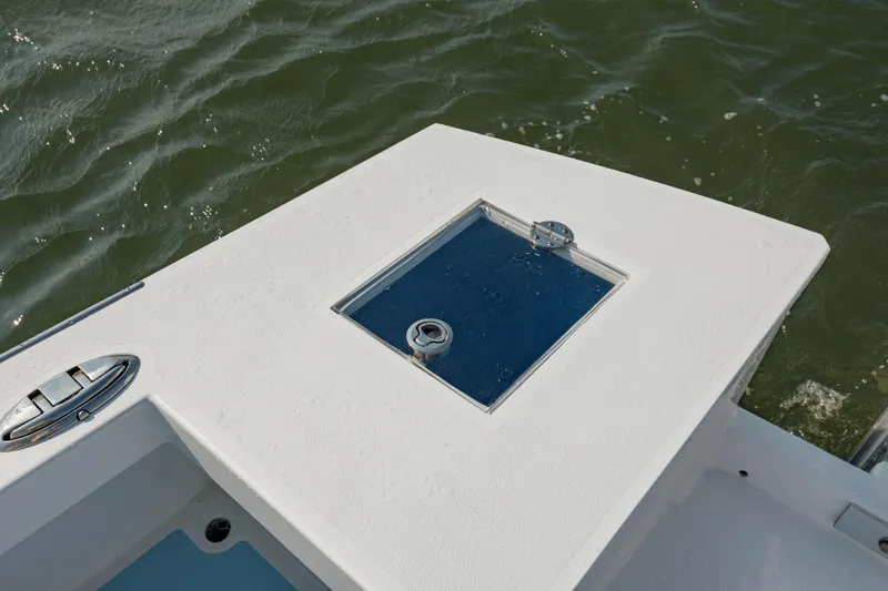 Slide: The Image of 2019 Gamefisherman 26 Cuddy Cabin boat deck with hatch, on water. - 15