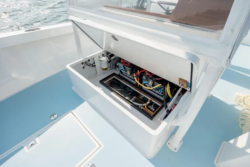 Slide: The Image of Open engine compartment of 2019 Gamefisherman 26 Cuddy Cabin boat, showcasing internal components. - 27