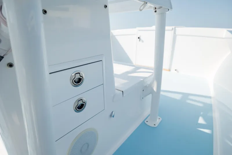 Slide: The Image of 2019 Gamefisherman 26 Cuddy Cabin interior with storage compartments and sleek design. - 37