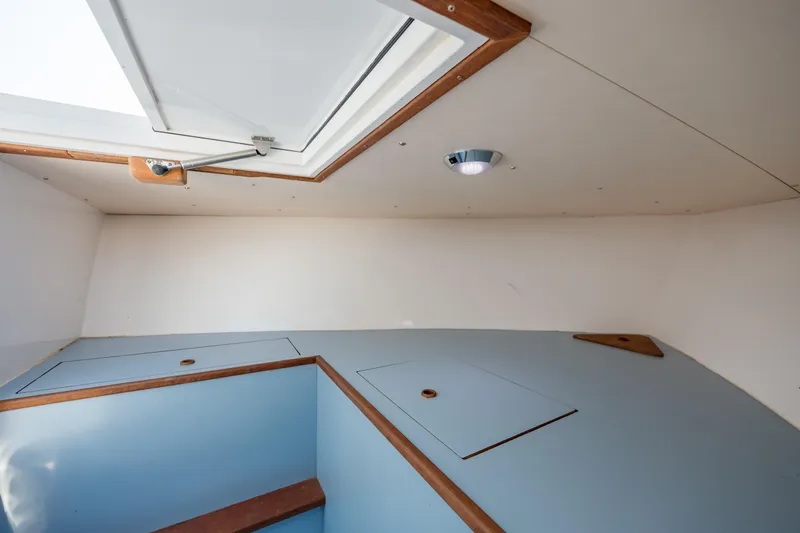 Slide: The Image of 2019 Gamefisherman 26 Cuddy Cabin interior with hatch and storage compartments. - 42