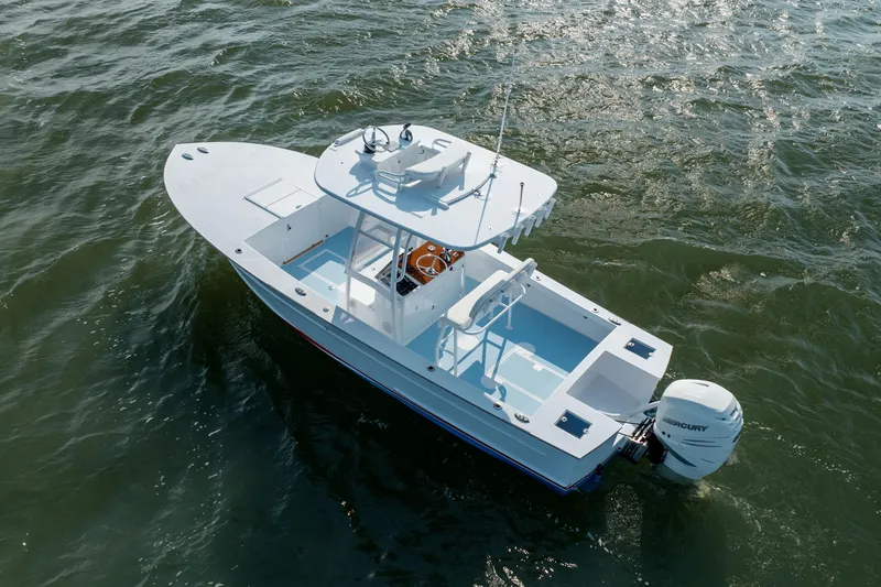 Slide: The Image of 2019 Gamefisherman 26 Cuddy Cabin boat on water, aerial view. - 60
