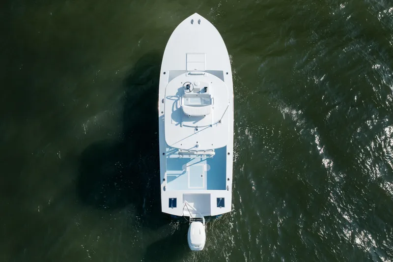Slide: The Image of Overhead view of 2019 Gamefisherman 26 Cuddy Cabin boat on water. - 61