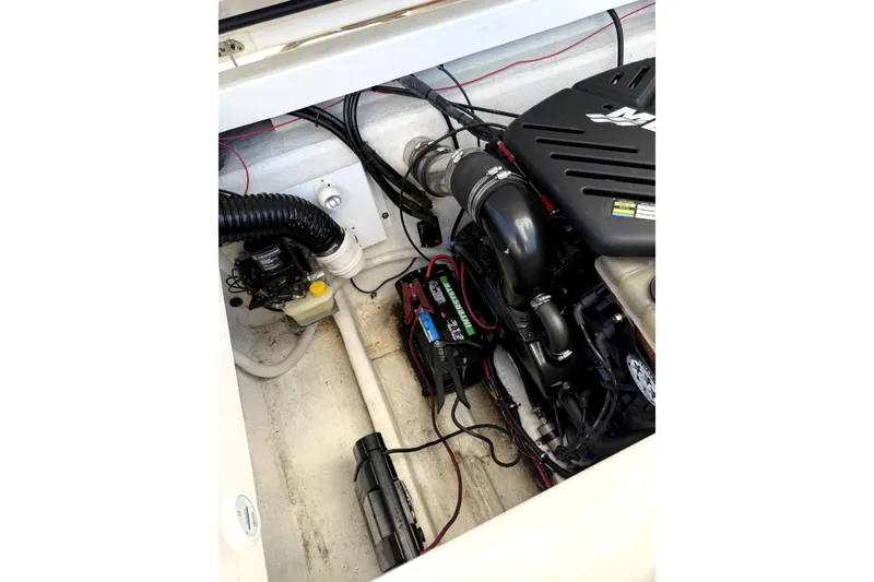 Slide: The Image of Engine compartment of 2003 Fountain 27 Fever boat, showcasing mechanical components. - 14