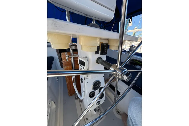 Slide: The Image of Cockpit of 1987 Irwin 44 sailboat with steering wheel and navigation instruments. - 11