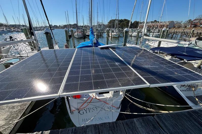 Slide: The Image of 1987 Irwin 44 sailboat with solar panels docked in a marina, Hampton, VA. - 15