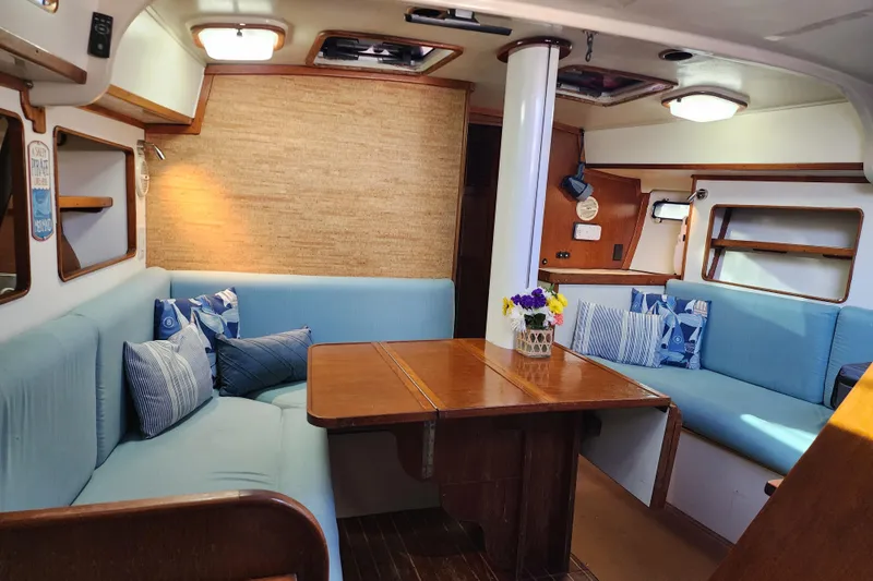 Slide: The Image of Interior of 1987 Irwin 44 sailboat with cozy seating and wooden table. - 23